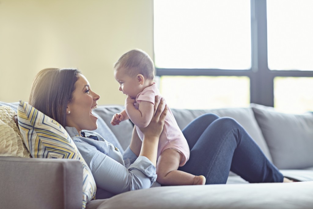 Mom and Baby on Couch- Lipsuction vs Tummy Tuck- Dr. Max Gouverne- Corpus Christi Moms Blog