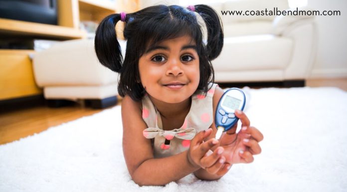 Little Girl with a Blood Sugar reader