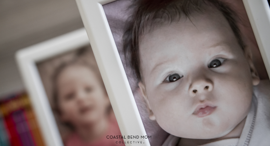 Image of a newborn baby in a white picture frame. Behind the first frame is a second white picture frame with a photo of a toddler. It is the same child, two years apart.