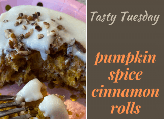 Image Reads: Tasty Tuesday, Pumpkin Spice Cinnamon Rolls with a photo of a fork spearing a bite of cinnamon roll.