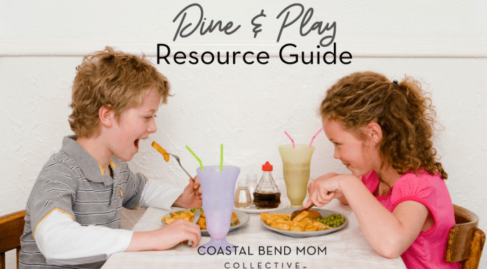 Image: A blonde haired boy wearing a gray polo shirt, sits at a table taking bite of a French fry. Across from him sits a brunette curly haired girl, also eating. Text reads: Dine & Play Resource Guide