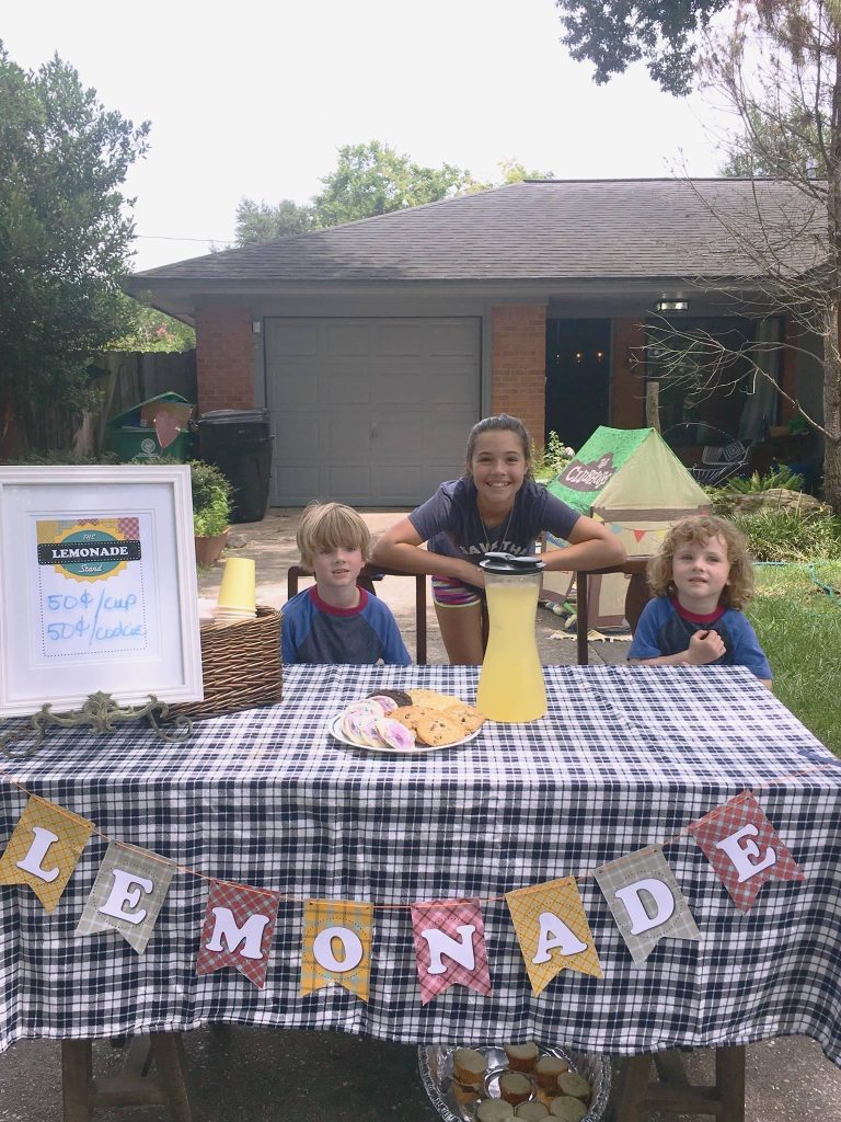 Children working at a lemonade stand 