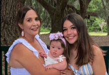 Amanda Weaver with her daughters, an adorable baby girl with Down's syndrome, and a beautiful teenaged girl with long brown hair.