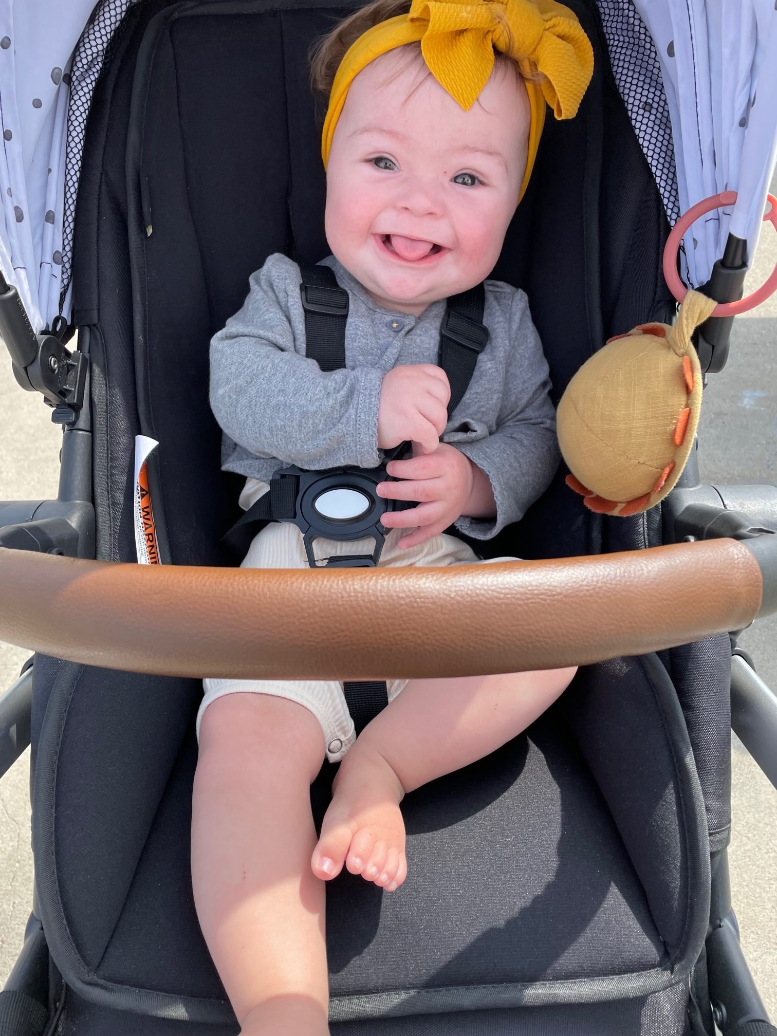 precious baby smiling in stroller