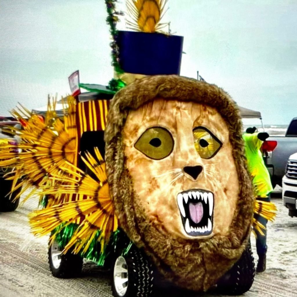 Image of Barefoot Mardi Gras parade "float" - it is a golf cart decorated to look like a lion.