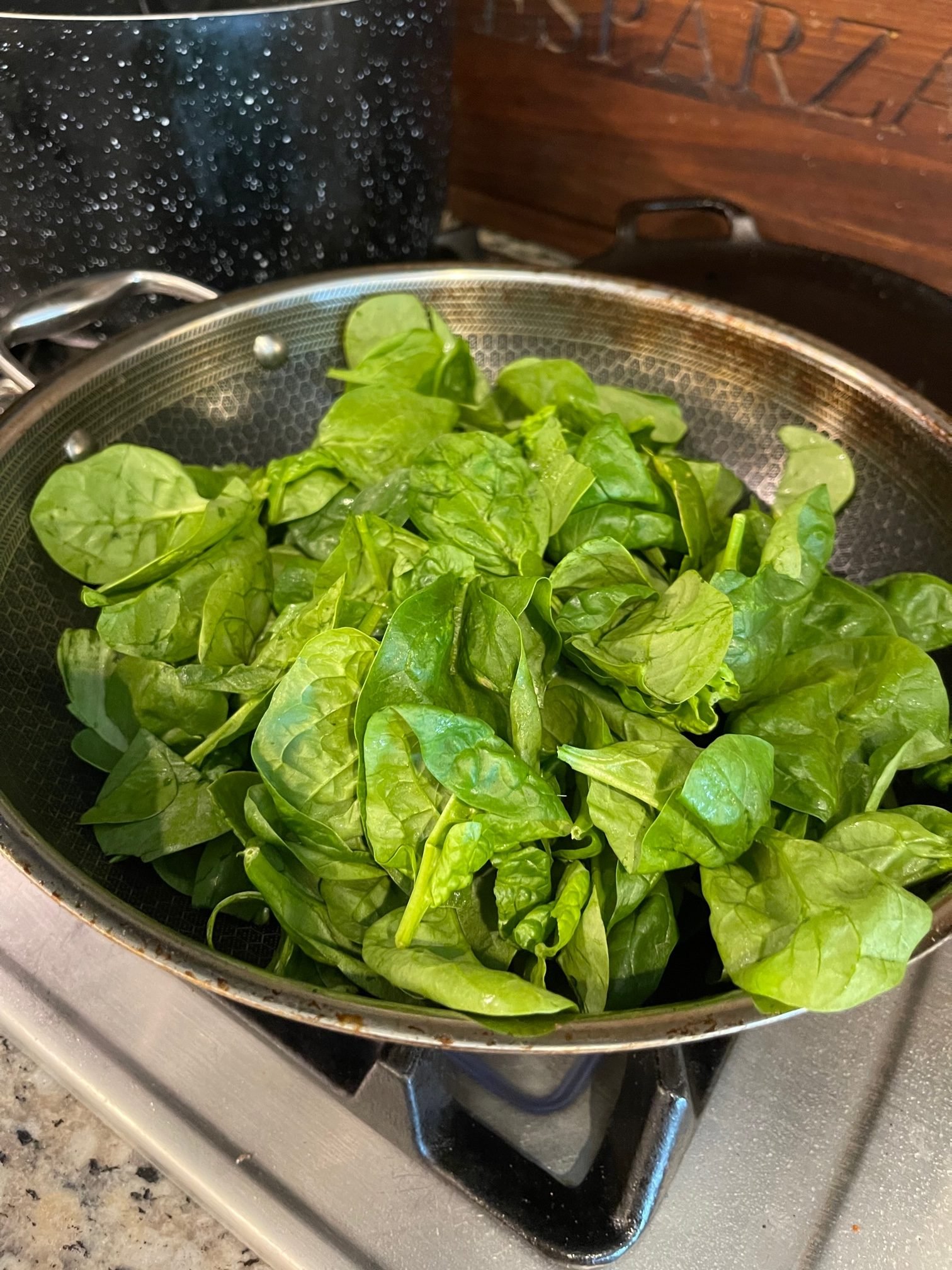 cook the spinach on a plan with butter