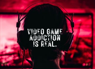 Image shows the shadow of the back of a teenager's head. The teen is wearing gaming headphones and facing a screen, indicating that the teenager is playing a video game.